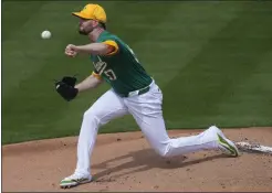  ?? MATT YORK — THE ASSOCIATED PRESS ?? A's starting pitcher Alex Wood became the first on the team to pitch into the fifth inning this spring, getting five strikeouts in a 4-2win over Seattle on Tuesday.