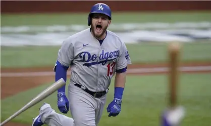  ?? Photograph: Eric Gay/AP ?? The Los Angeles Dodgers’ Max Muncy celebrates his grand slam during the first inning Wednesday’s Game 3 of the National League Championsh­ip Series in Arlington, Texas.