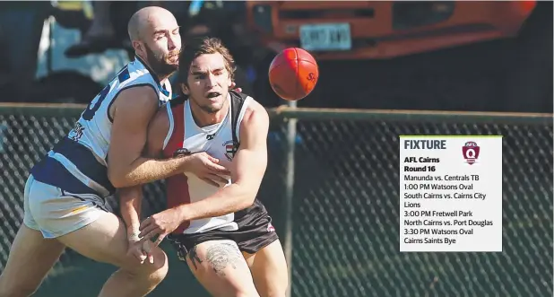  ?? Picture: BRENDAN RADKE ?? INTERCEPT: Port Douglas Crocs' Adam Gross knocks Cairns Saints' Tom Pearce off the ball.