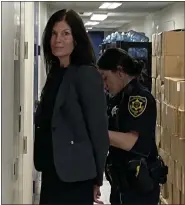  ?? PHOTO BY CARL HESSLER JR. ?? Former Pennsylvan­ia Attorney General Kathleen Kane is escorted by a sheriff’s deputy to a Montgomery County courtroom for a probation violation hearing.