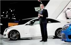  ??  ?? Cadillac President Johan de Nysschen speaking about the Cadillac ATS-V during the model’s world debut at the Los Angeles Auto Show in Los Angeles, California