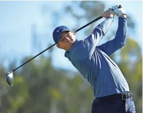  ??  ?? Rory Mcilroy hits his tee shot on the 14th hole during the second round of the Farmers Insurance Open on Jan. 25 in San Diego. DENIS POROY/AP