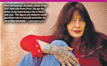  ?? | KAREN KUEHN PHOTO ?? Poet and musician Joy Harjo, winner of the 2017 Ruth Lilly Poetry Prize. She got the tattoo on her hand during a trip to Tahiti and says, “The figures are related to ocean guardians and are basically protection for my writing and music.”