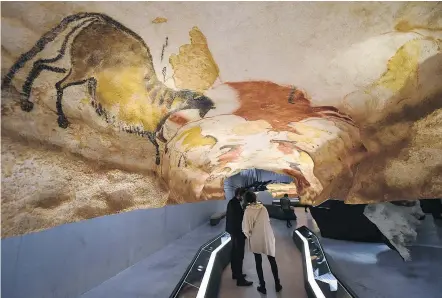  ?? — GETTY IMAGES FILES ?? People visit the replica of the Lascaux cave paintings last year in Montignac, in southwest France, more than seven decades after the prehistori­c art was first discovered.