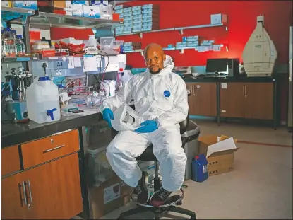  ?? (AP/Jerome Delay) ?? Sandile Cele, a doctoral candidate at the University of Kwazulu-Natal, poses in a lab in Durban, South Africa.