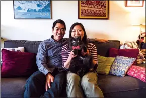  ?? DEAN RUTZ/SEATTLE TIMES ?? Suzie Kwon and Kevin Driscoll, with Nash, their cat, are finishing their profession­al training and plan to get married in July.