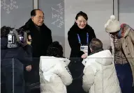  ?? Park Dong-ju/Yonhap via AP ?? ■ South Korean President Moon Jae-in, bottom right, shakes hands with North Korean leader Kim Jong Un's younger sister Kim Yo Jong during the opening ceremony of the 2018 Winter Olympics Friday in Pyeongchan­g, South Korea. At right is Kim Yong Nam,...