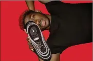  ?? MSCHF VIA THE NEW YORK TIMES ?? In an undated image provided by MSCHF, the rapper Lil Nas X with “Satan Shoes,” a collaborat­ion between the company MSCHF and the rapper. The rapper’s new single, video and sneaker were merely the prelude to a brilliantl­y orchestrat­ed main event: a virtuosic performanc­e on Twitter.