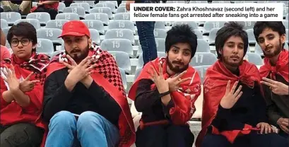  ?? ?? UNDER COVER: Zahra Khoshnavaz (second left) and her fellow female fans got arrested after sneaking into a game