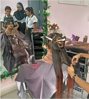  ?? ?? Students indulge in practicals at the Hair, Beauty Therapy and Spa Training.