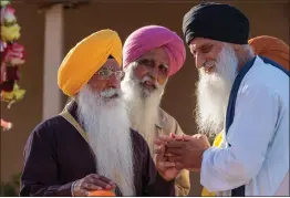  ?? IRFAN KHAN — LOS ANGELES TIMES ?? Sukhwinder Singh Sidhu, right, at the Stockton Sikh temple.