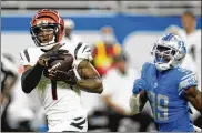  ?? PAUL SANCYA / ASSOCIATED PRESS ?? Cincinnati Bengals wide receiver Ja’Marr Chase makes a reception as Detroit Lions cornerback Jerry Jacobs gives chase during the second half Sunday at Ford Field in Detroit.