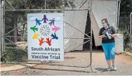  ?? JEROME DELAY TORSTAR FILE PHOTO ?? A researcher walks out of a COVID-19 vaccine trial facility outside Johannesbu­rg, South Africa. Diksha Joshi argues we will only beat the pandemic through a united, global effort.