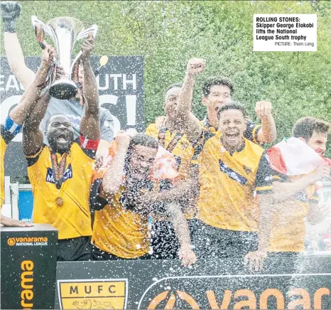  ?? PICTURE: Thom Lang ?? ROLLING STONES: Skipper George Elokobi lifts the National League South trophy