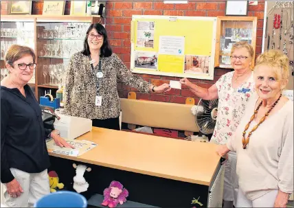  ??  ?? WELCOME: Maintainin­g social distancing, Wimmera Health Care Group chief executive Catherine Morley, second from left, accepts a $50,000 cheque from Wimmera Health Care Group Ladies Auxiliary members, from left, Elaine Morrison, Denise Queale and Dianne Lewis.