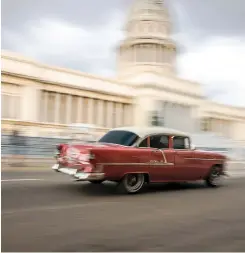  ??  ?? Classic cars are everywhere in Cuba, in all states of repair. Many are used as taxis, which offers an interestin­g way to take in all the sights in Havana, including El Capitolio (above). El Morro castle made an impressive backdrop for the Cruising World Parade of Boats into Havana Harbor (right).