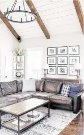  ??  ?? A modern farmhouse feel comes via rustic beams and shiplap, including in the family room.