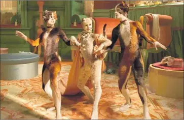  ?? Universal Pictures ?? FRANCESCA HAYWARD is flanked by her fellow furry “Cats” Naoimh Morgan, left, and Danny Collins.