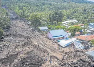  ?? REUTERS ?? An aerial picture shows houses damaged by landslides triggered by tropical cyclone Seroja in East Flores, East Nusa Tenggara province, Indonesia on Thursday.