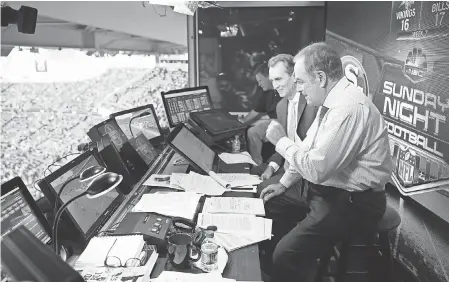  ??  ?? Al Michaels, right, and Cris Collinswor­th prepare for a “Sunday Night Football” broadcast. MARC PISCOTTY/SPECIAL TO USA TODAY