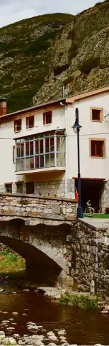  ??  ?? Above: Cyclist rides through the sleepy town of Portilla de la Reina after the descent from Puerto de Pandetrave­s