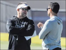  ?? Las Vegas Review-journal @Heidifang ?? Heidi Fang
With 11 picks in the draft, Raiders coach Josh Mcdaniels, left, and general manager Dave Ziegler kept busy at the combine.