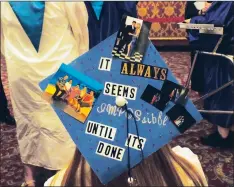 ??  ?? Clockwise from top left, Cumberland High senior Amber Newman shows off her graduation cap design, with a special message on her mortarboar­d; Valedictor­ian David Cabatingan gives his address; graduates of the Cumberland High School Class of 2017 wait on...