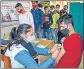  ?? ?? A healthcare worker provides a dose of Covid-19 vaccine to a beneficiar­y in Gurugram.