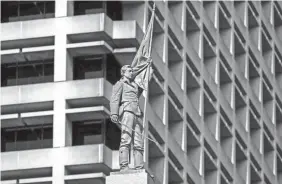  ?? BILL TIERNAN/AP FILE ?? The 15-foot figure of a Confederat­e soldier will be moved from downtown Norfolk, Va., to a local cemetery, officials have determined.