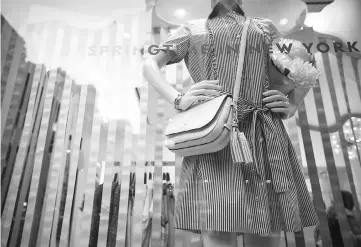  ??  ?? A mannequin is displayed in the window of a Kate Spade & Co. store in New York on Feb 28, 2016. — WP-Bloomberg photo