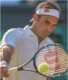  ?? TODAY SPORTS SUSAN MULLANE / USA ?? Roger Federer hits a shot during his 7-6 (3), 1-6, 6-3, 6-4 victory over Rafael Nadal in the Wimbledon semifinals Friday.