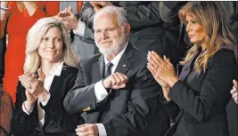  ?? The Associated Press file ?? Rush Limbaugh reacts as first lady Melania Trump, right, and his wife, Kathryn, applaud during President Donald Trump’s Feb. 2020 State of the Union address.