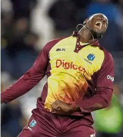  ?? — Reuters ?? Ecstatic: West Indies’ Carlos Brathwaite celebratin­g after taking the wicket of England’s Liam Plunkett.