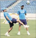  ?? PTI ?? Kohli and Dhoni during a training session in Pune on Tuesday.