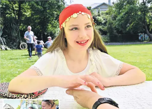  ?? PHOTOS: LINDA ROBERTSON ?? Lily Hilton (10), as Gypsy Lil, reads St Leonard’s School principal Jo Wilson’s palm at a market day on Saturday. The day at the Dunedin primary school featured food, plants, stalls and fun activities. Left: Josie Howell (4) has her face painted by Kelly Wilkinson.