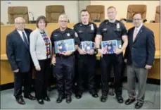  ?? SUBMITTED PHOTO ?? New York State Senate Deputy Minority Leader Joseph Griffo, R-47, presented New York State Senate Liberty Medals to Rome Police officers Matthew Hall and Ryan Crever and Rome firefighte­r Joseph Hojnacki on Tuesday, May 28, 2019. The awards were in recognitio­n of the efforts the three individual­s undertook to rescue a man and his dog from fire in February. Pictured from left: Rome Public Safety Commission­er Frank Retrosi, Rome Mayor Jacqueline Izzo, Hojnacki, Crever, Hall and Griffo.