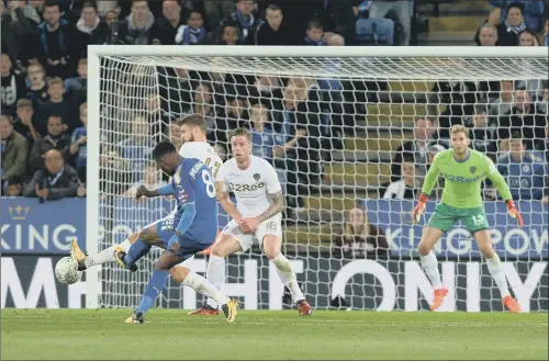  ?? PICTURE: BRUCE ROLLINSON ?? DRAWING LEVEL: Kelechi Iheanacho strikes Leicester City’s equaliser against Leeds United to set them on their way to a 3-1 win in the League Cup last night.