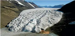  ?? AP ?? The Taylor Glacier near McMurdo Station, Antarctica, ploughs its way downhill. According to a new study, Antarctic glaciers are melting more than six times faster than they did in the 1970s.