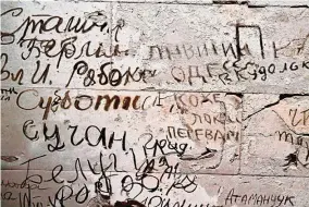  ??  ?? The graffiti, which the German parliament voted to preserve after the Reichstag’s reopening in 1999, is emblematic of Germany’s approach to ‘memorial culture’ in keeping especially painful reminders of the past visible as a lesson to future generation­s.