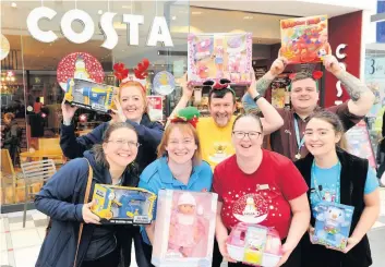  ??  ?? Festive cheer Support for toy appeal at Costa donation station from – front row left to right: Joanna Baker, Carol Gillies, Leeann Burns and Chloe Gillies. Back: Jenna Boyce, Ramsay Chisholm Turner and Andrew Jamieson