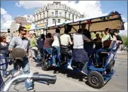  ?? Picture: REUTERS ?? TIPPLER TRIP: Tourists cycle as they drink beer and sing karaoke on a beer bike in Amsterdam in this file photo.