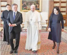  ?? — Reuters ?? Pope Francis with South Korean President Moon Jae-in and his wife Kim Jung-sook during a private audience at the Vatican on Thursday.