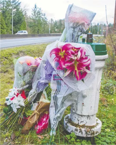  ?? JASON PAYNE FILES ?? Memorial flowers on Dec. 1, 2018, along the Barnet Highway in Burnaby near the spot where Nicole Hasselmann died Nov. 16 after a car crash. Hasselmann's boyfriend, Jan Poepl, has been found guilty of second-degree murder after a police probe into the incident.