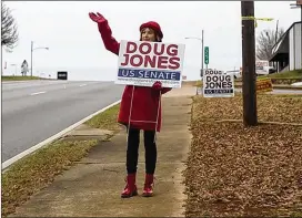  ?? MAURA FRIEDMAN / THE NEW YORK TIMES ?? LaNita Bennett promotes Democratic U.S. Senate candidate Doug Jones outside his headquarte­rs in Anniston, Ala., in December 2017. Democratic tech experts decided to try Russian-style tactics in the fiercely contested race.