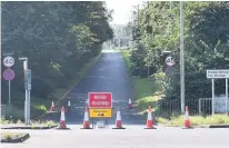  ??  ?? Locals at The Calvers, Runcorn, say a stagnant pond was a dumping ground for fly-tippers; now repair works are taking place, above left, which have shut the Central Expressway slip road, above