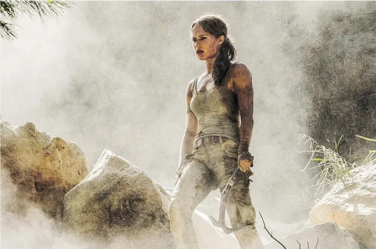  ?? — WARNER BROS. PICTURES ?? Angelina who? Alicia Vikander offers her take on Lara Croft in a reboot of Tomb Raider. Angelina Jolie starred in the 2001 film inspired by the video game.