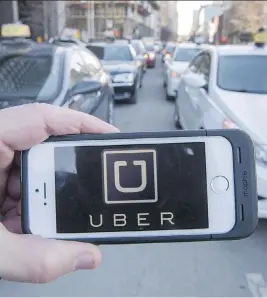  ?? RYAN REMIORZ THE CANADIAN PRESS ?? Uber officials, who dismissed Calgary’s ride-sharing bylaw after saying its rules were too restrictiv­e, will meet with city officials Thursday.