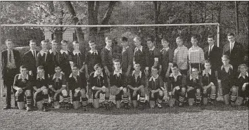  ?? Photo contribute­d by the Brown family ?? James Brown Sr., at left, with one of the Brunswick School soccer teams he coached.