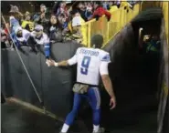  ?? MIKE ROEMER — ASSOCIATED PRESS ?? The Lions’ Matthew Stafford shakes hands with fans after beating the Packers on Nov. 6 in Green Bay, Wis.