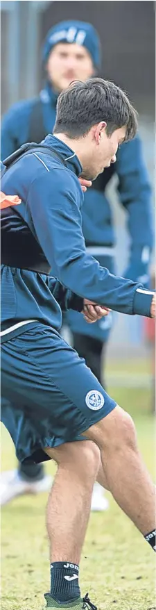  ?? Picture: Perthshire Picture Agency. ?? Liam Craig tackles Aaron Comrie during training at McDiarmid Park.